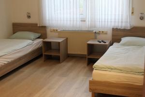Postel nebo postele na pokoji v ubytování Hotel Garni Postkutsche
