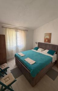 Postel nebo postele na pokoji v ubytování Apartments Jerković Drašnice-1bd