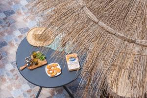 a table with a tray of food on top of a couch at Villa Sultana by Living Essaouira in Essaouira