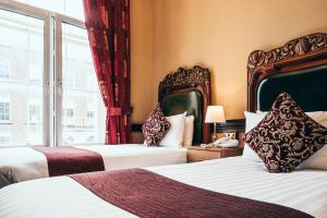 Postel nebo postele na pokoji v ubytování Russell Court Hotel