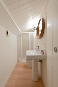 a bathroom with a sink and a mirror at Pietranera - Sicilian Escape Retreat in Linguaglossa +15 photos