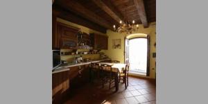 a kitchen with a table and chairs and a window at Bed and Breakfast Vùa in Bova +29 photos