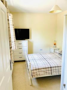 Ένα ή περισσότερα κρεβάτια σε δωμάτιο στο Northants Guest House