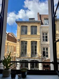 a view of a building from a window at LILLEHOSTS 1, Vieux Lille, Newly renovated, Modern & Stylish apartment, perfectly located in Lille