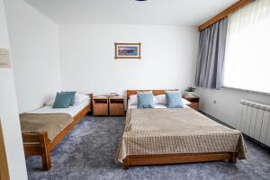 Ένα ή περισσότερα κρεβάτια σε δωμάτιο στο Apartament u Chyców