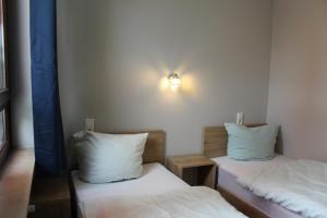 Postel nebo postele na pokoji v ubytování Hotel Garni Postkutsche