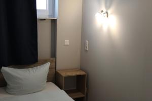 Postel nebo postele na pokoji v ubytování Hotel Garni Postkutsche