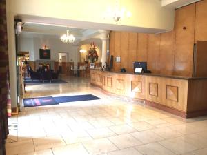a lobby with a reception desk in a building at Millennium Hotel Glasgow in Glasgow