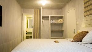Cama ou camas em um quarto em Pousada Hospedaria215