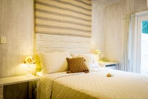 Cama ou camas em um quarto em Pousada Hospedaria215