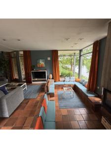 a living room with a couch and a table at Domaine Heyen in Waimes
