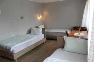 Postel nebo postele na pokoji v ubytování Hotel Garni Postkutsche