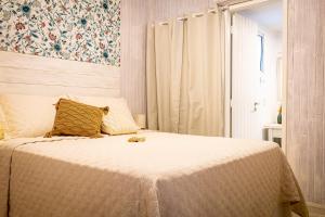 Cama ou camas em um quarto em Pousada Hospedaria215