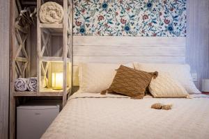Cama ou camas em um quarto em Pousada Hospedaria215
