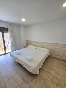 Posteľ alebo postele v izbe v ubytovaní SM Apartments