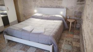 Postel nebo postele na pokoji v ubytování Piazzetta Scolanova