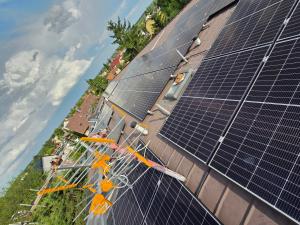 a group of solar panels on the side of a building at Hotel Jahodnice in Prague