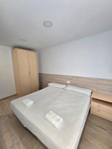 Posteľ alebo postele v izbe v ubytovaní SM Apartments