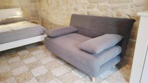 Postel nebo postele na pokoji v ubytování Piazzetta Scolanova