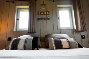 Postel nebo postele na pokoji v ubytování Gite Chambre d'hotes insolite dans un pigeonnier à 5 minutes de Marciac Gers
