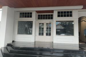 a house with white doors and windows at Cipto Apartment in Bandung