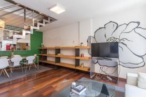 a living room with a large mural on the wall at Apartment Barcelona Rentals - Swimming Pool with Terrace in Barcelona