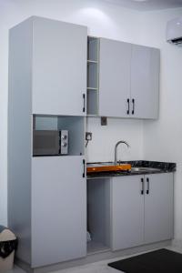 Kuchyň nebo kuchyňský kout v ubytování Havilland Apartments