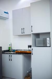 Kuchyň nebo kuchyňský kout v ubytování Havilland Apartments
