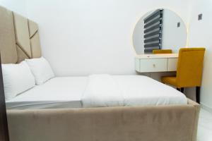 Postel nebo postele na pokoji v ubytování Havilland Apartments