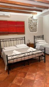 a bedroom with two beds in a room at Agriturismo Le Sodine in Morolo