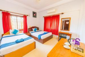 Postel nebo postele na pokoji v ubytování Golden Papaya Guesthouse