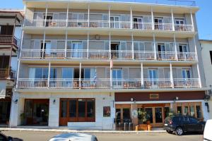 an apartment building with balconies on a street at Art Pythia Boutique in Delphi