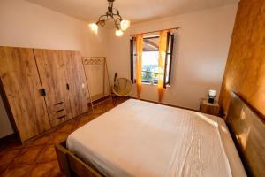 a bedroom with a large bed and a window at Baia Marina Suite with private jacuzzi in Balestrate +30 photos