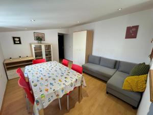 a living room with a table and a couch at Apartments Valentino by Pag tours in Pag