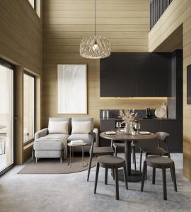 a living room with a couch and a table and chairs at Levin Lyhty Bea by Hilla Villas in Kittilä