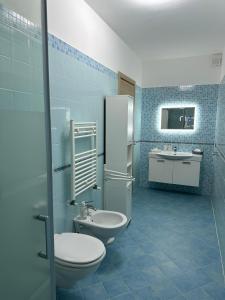 a bathroom with a toilet and a sink at Il Sogno di Olly - Assisi in Santa Maria degli Angeli