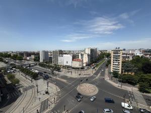 an aerial view of a street in a city at Apartment in the sky of Paris in Paris