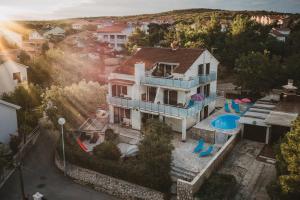 an aerial view of a house with a swimming pool at Villa Sarah in Klimno