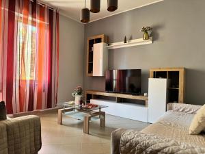 a living room with a couch and a table at casa Martina - LuxRental Apartments in Pescara