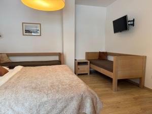 Postel nebo postele na pokoji v ubytování Penzion Stará Vápenka