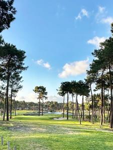 a view of a golf course with trees at Aroeira Luxury Azul Villa, Lisboa, Beach, Surfing, Golf, Exploring, Hiking, Fishing in Charneca