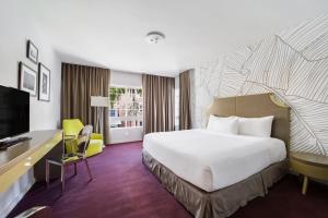 TV a/nebo společenská místnost v ubytování Alamo Hotel + 17 fotografií