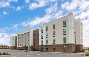 a large white building with a parking lot at Extended Stay America Premier Suites - Bradenton in Bradenton