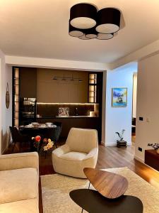 a living room with a couch and a table at Oakline Apartments in Pristina