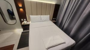 Postel nebo postele na pokoji v ubytování Melody Queen Hotel by AURA