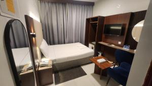 Postel nebo postele na pokoji v ubytování Melody Queen Hotel by AURA