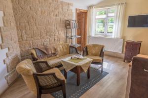 Μια τηλεόραση ή/και κέντρο ψυχαγωγίας στο Landhaus Rundblick im Elbsandsteingebirge bei Bad Schandau