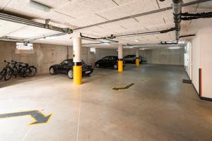 an empty parking garage with cars parked in it at Hotel het Zwaantje in Callantsoog