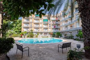 a swimming pool in front of a apartment building at Via Aurelia 17 Cozy Apartment in Salou