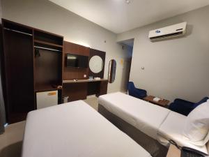 Postel nebo postele na pokoji v ubytování Melody Queen Hotel by AURA